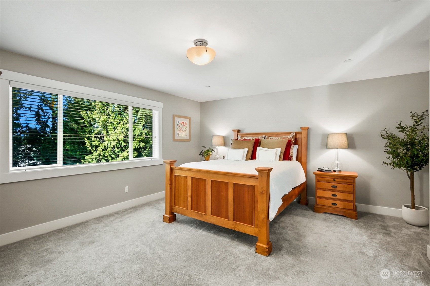 21808 31st Drive Southeast Bothell, WA 98021 - Photo 26 of 39 a bedroom with bed and a potted plant