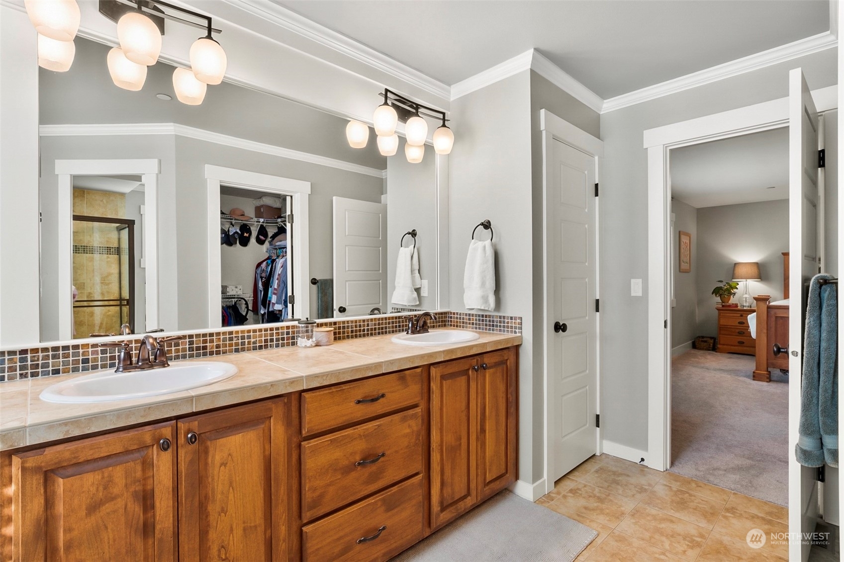 21808 31st Drive Southeast Bothell, WA 98021 - Photo 29 of 39 a bathroom with a double vanity sink and a mirror