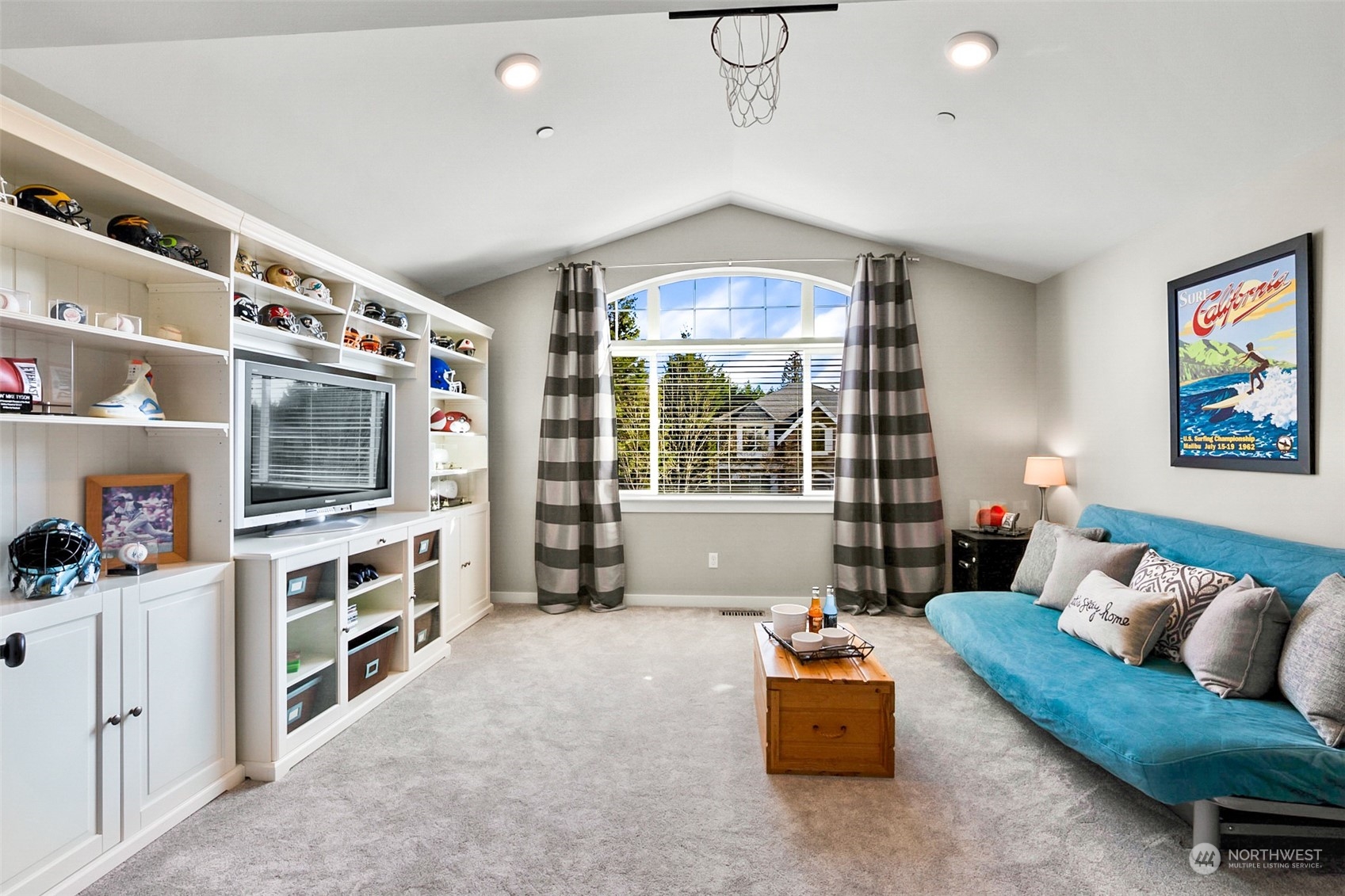 21808 31st Drive Southeast Bothell, WA 98021 - Photo 31 of 39 a living room with furniture and a flat screen tv