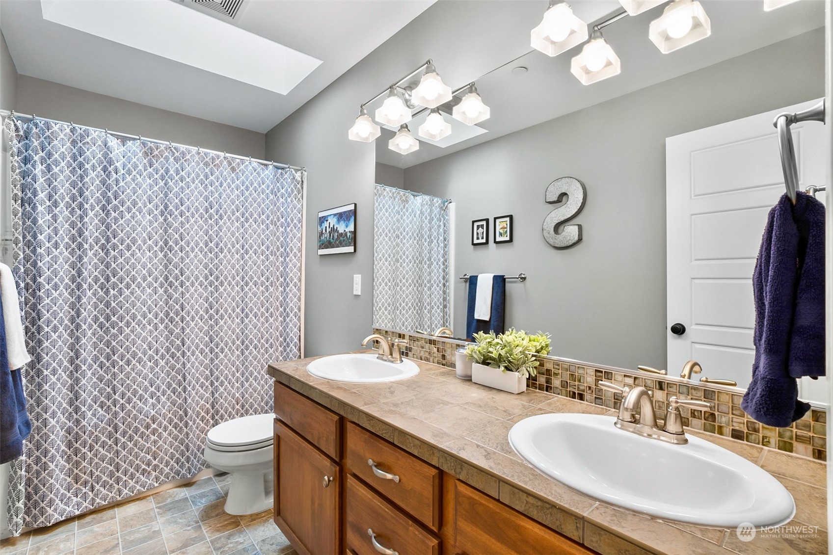 21808 31st Drive Southeast Bothell, WA 98021 - Photo 33 of 39 a bathroom with a double vanity sink mirror and toilet