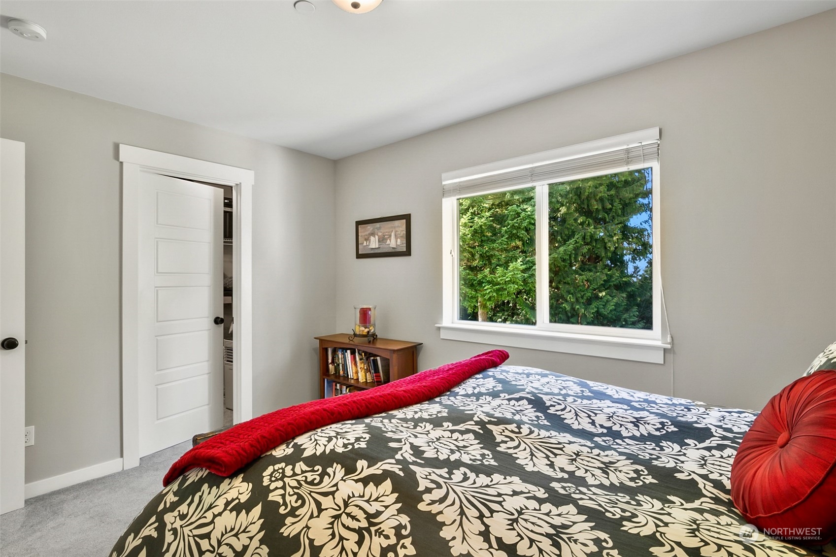 21808 31st Drive Southeast Bothell, WA 98021 - Photo 36 of 39 a bed sitting in a bedroom next to a window