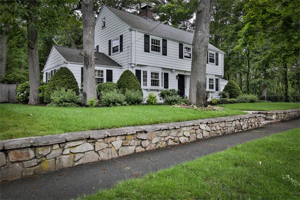 32 Wyndmere Road Milton, MA 02186 - Photo 1 of 30 a front view of a house with a yard and garage