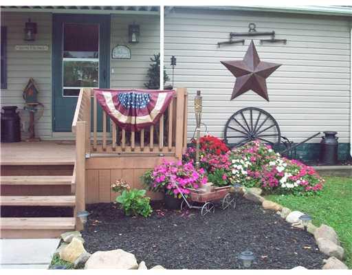 3317 North Hermitage Road Transfer, PA 16154 - Photo 3 of 18 Exterior Front. Beaujtifully landscaped and decorated around the outside of home..