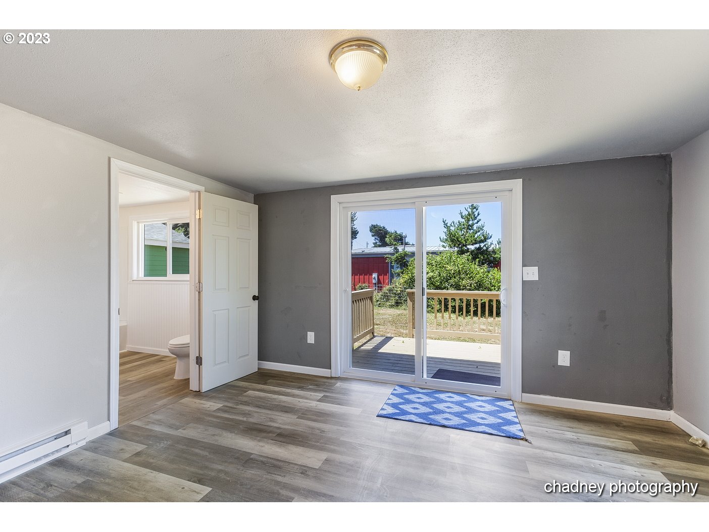 5707 Northwest Rhododendron Street Newport, OR 97365 - Photo 17 of 20 a view of an empty room with a window