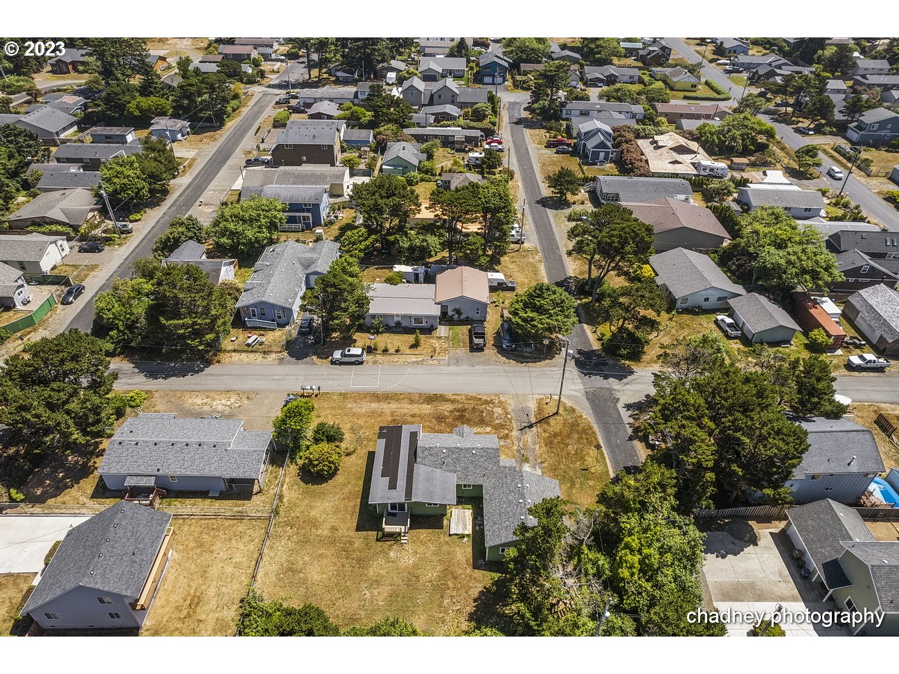 5707 Northwest Rhododendron Street Newport, OR 97365 - Photo 20 of 20 an aerial view of residential houses with outdoor space