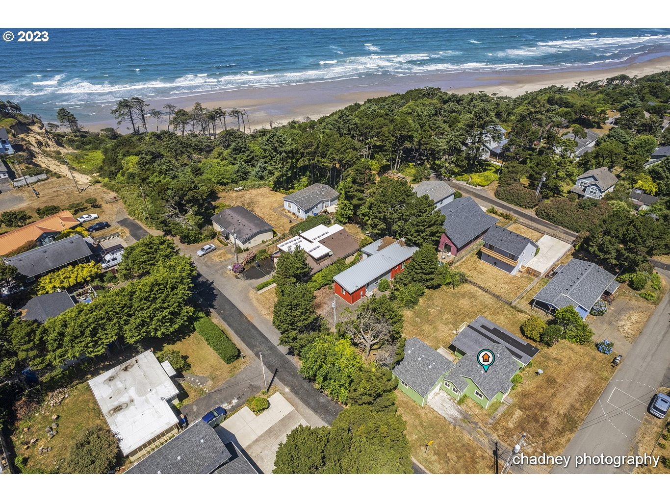 5707 Northwest Rhododendron Street Newport, OR 97365 - Photo 7 of 20 an aerial view of residential houses with outdoor space