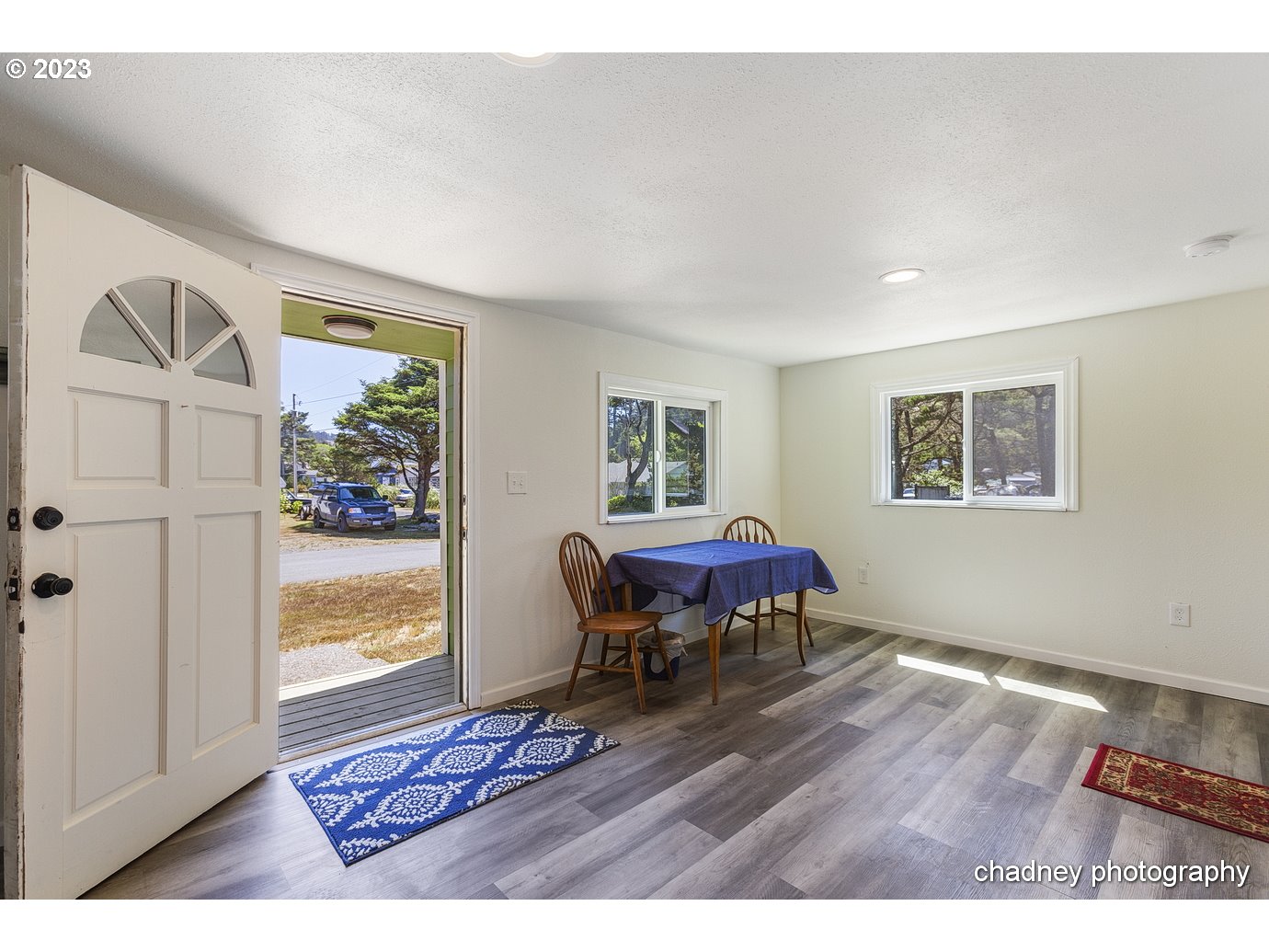 5707 Northwest Rhododendron Street Newport, OR 97365 - Photo 9 of 20 a living room with furniture and a window