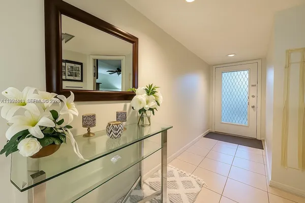 a bathroom with a sink mirror and vanity