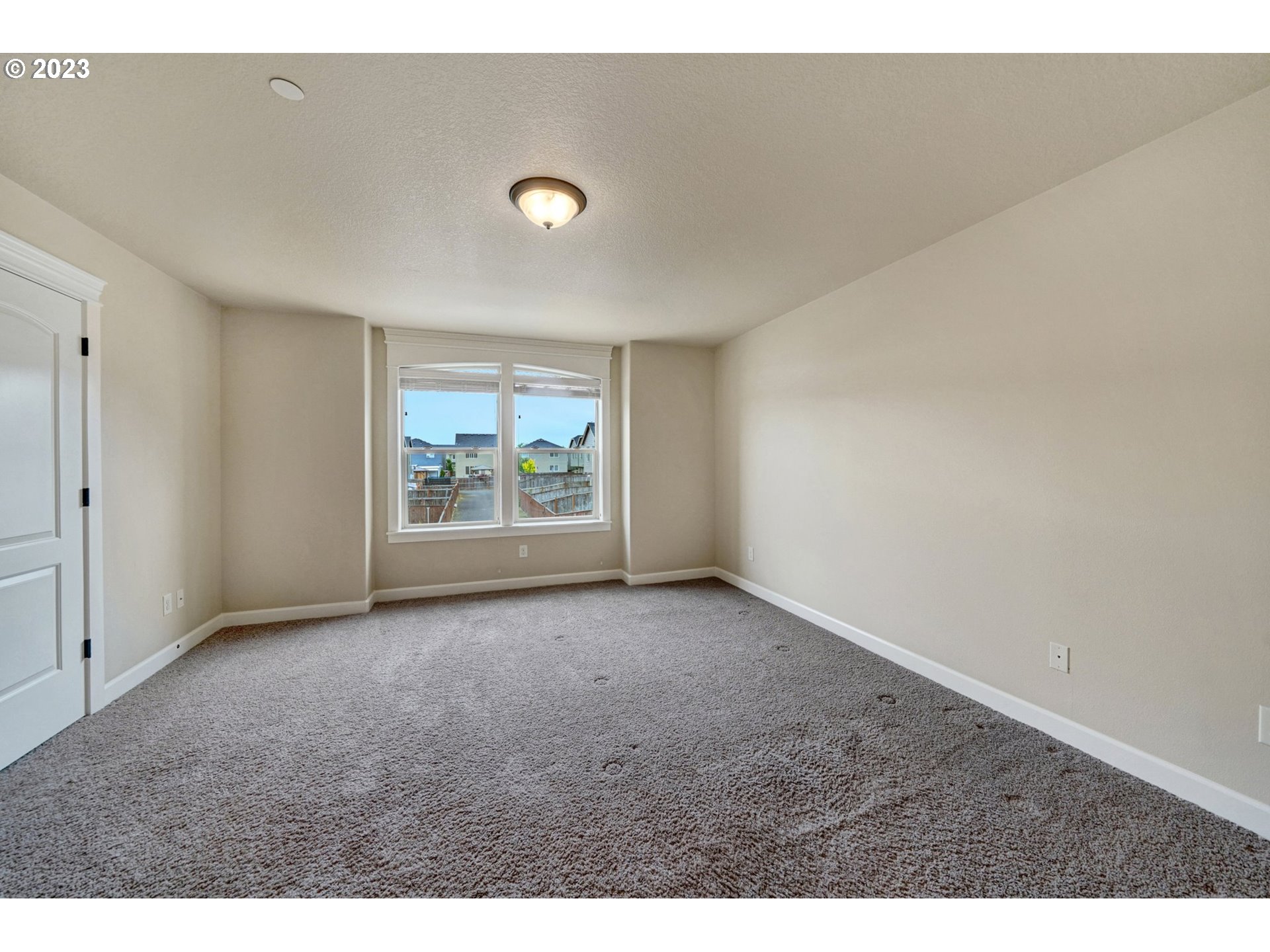 235 North 33rd Court Ridgefield, WA 98642 - Photo 12 of 30 an empty room with windows