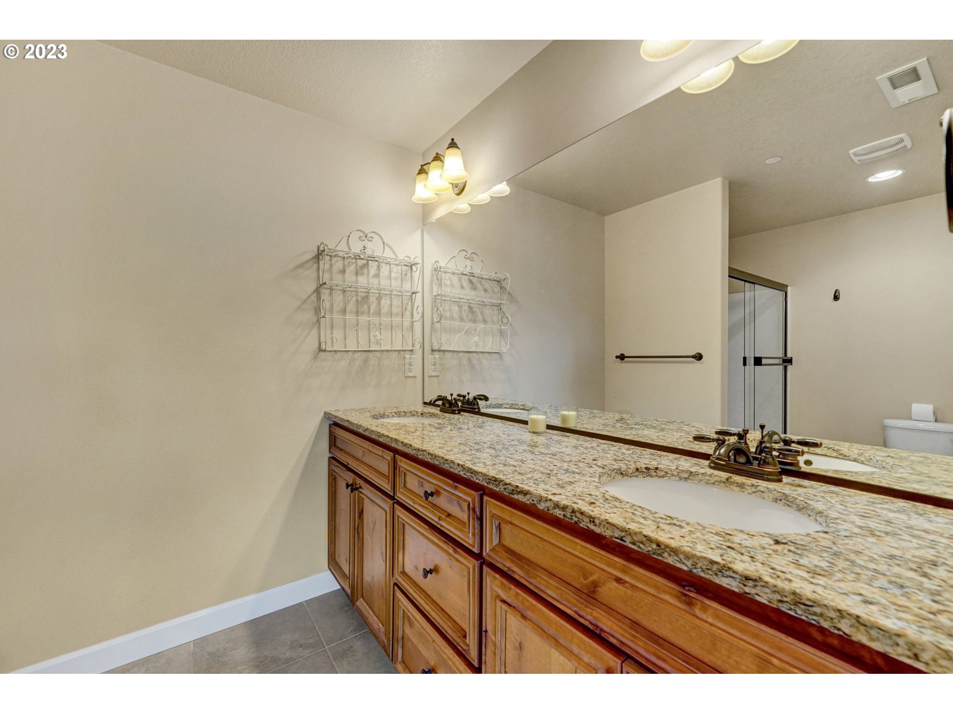 235 North 33rd Court Ridgefield, WA 98642 - Photo 16 of 30 a bathroom with a sink and a mirror