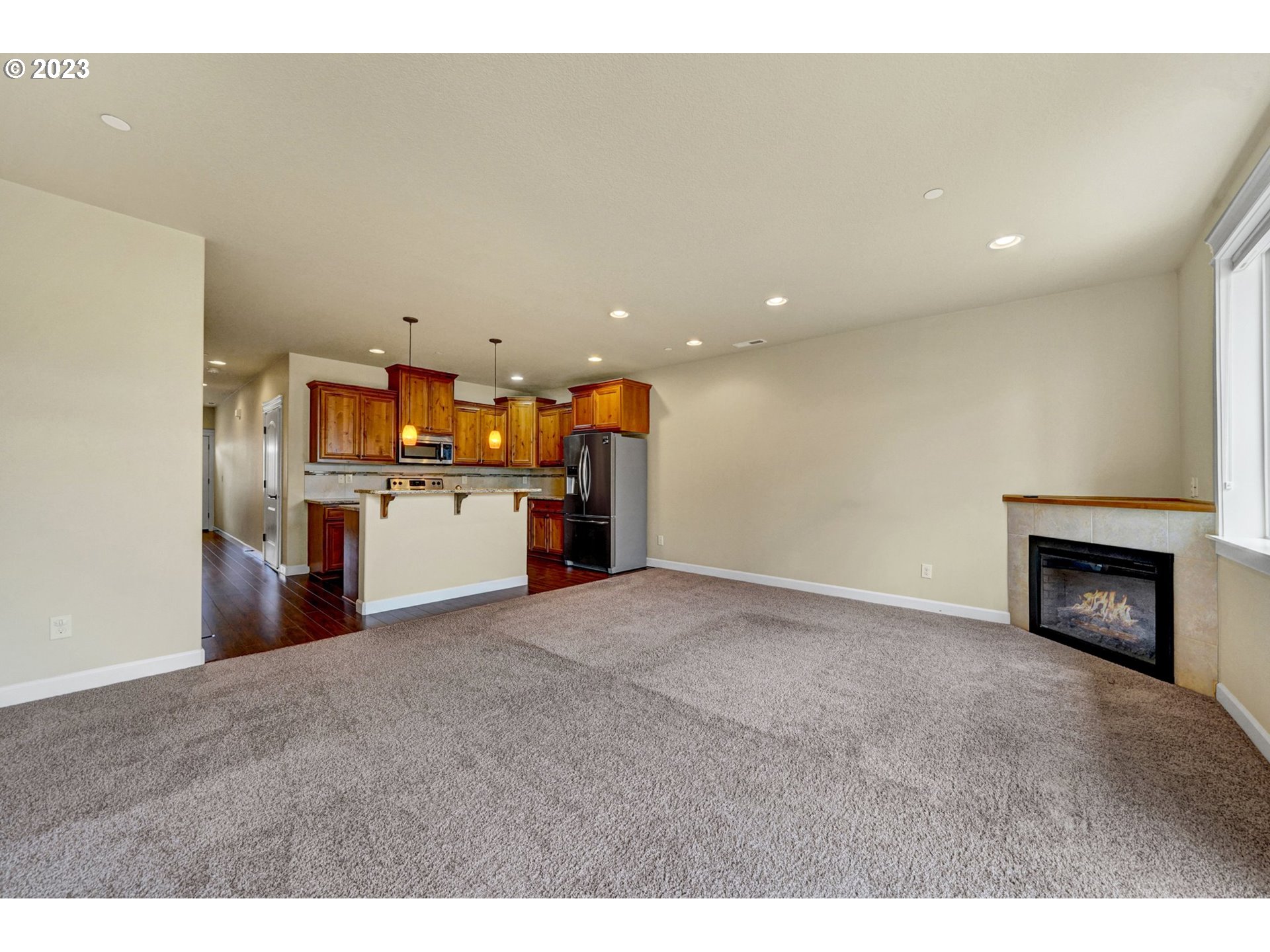 235 North 33rd Court Ridgefield, WA 98642 - Photo 10 of 30 a view of a kitchen with a sink and a fireplace