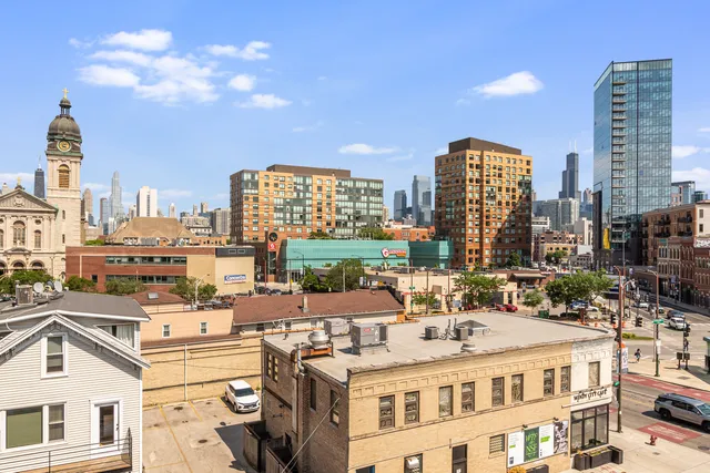 a large building with a city view