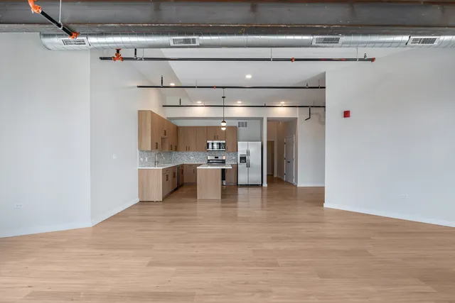 a view of a kitchen with a refrigerator
