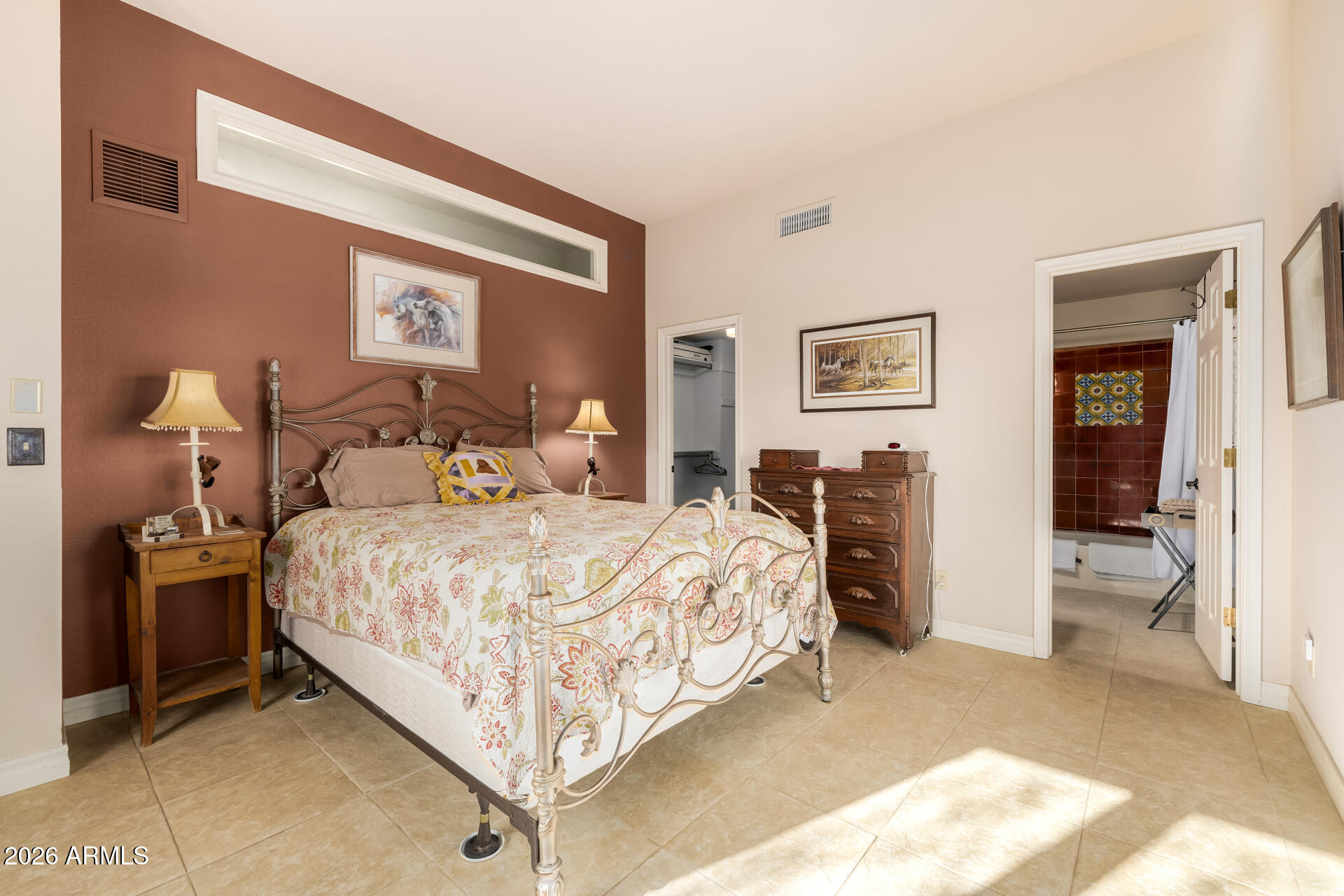 38065 North Cave Creek Road, Unit 6 Cave Creek, AZ 85331 - Photo 24 of 34 a bedroom with a bed and a view of bathroom