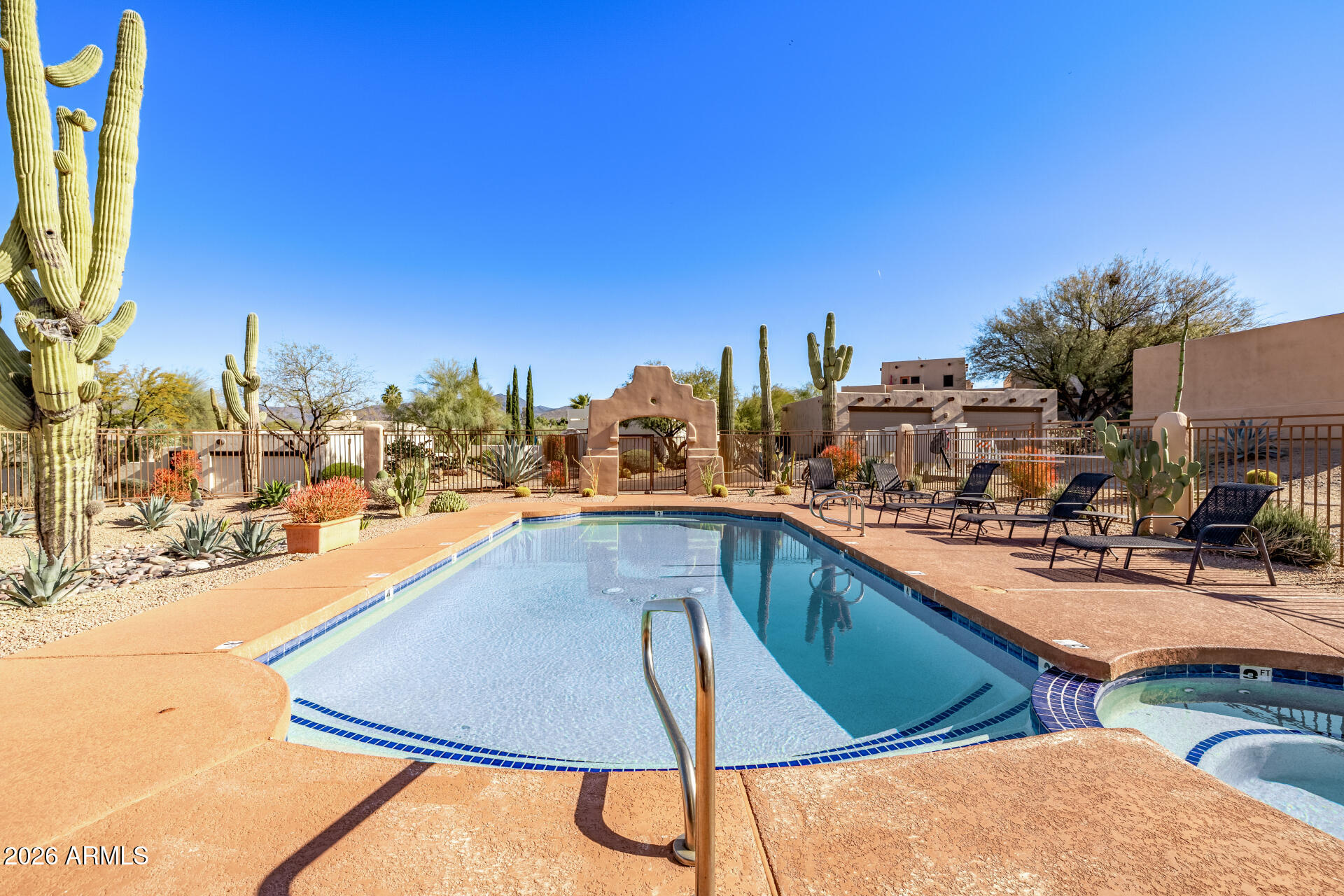38065 North Cave Creek Road, Unit 6 Cave Creek, AZ 85331 - Photo 33 of 34 a view of a swimming pool with chairs