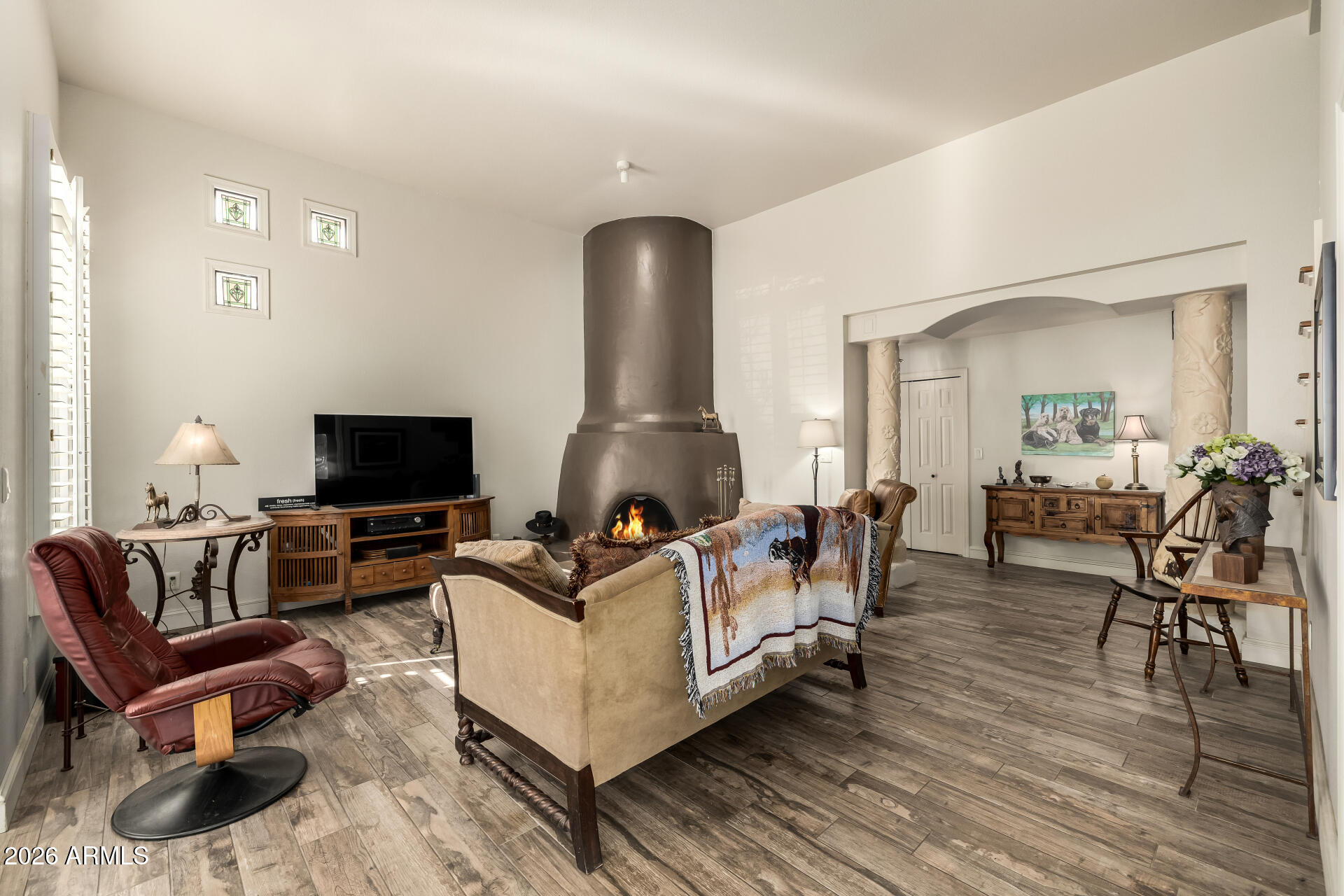 38065 North Cave Creek Road, Unit 6 Cave Creek, AZ 85331 - Photo 10 of 34 a living room with furniture and a flat screen tv