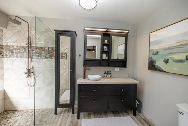 a bathroom with a double vanity sink and mirror