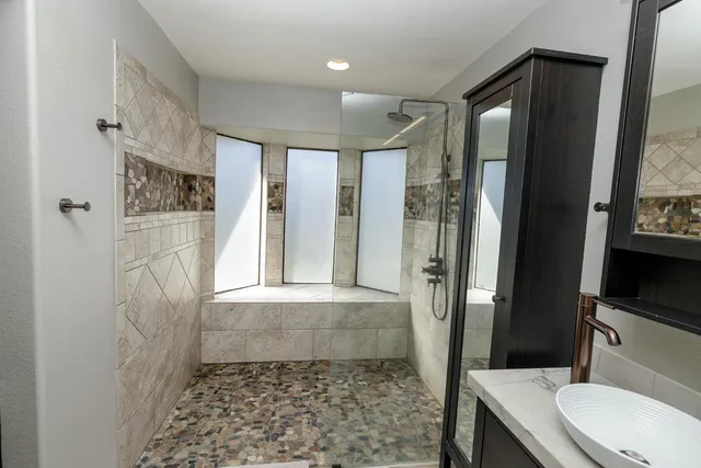 a bathroom with a shower and a toilet