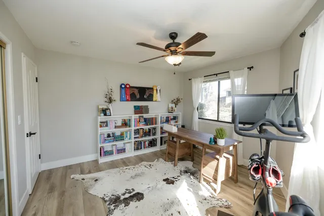 a bedroom with furniture and a window