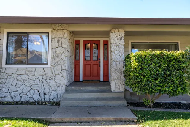 a front view of a house with a yard