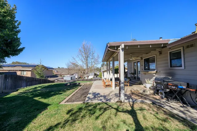 a view of a chairs and table in patio