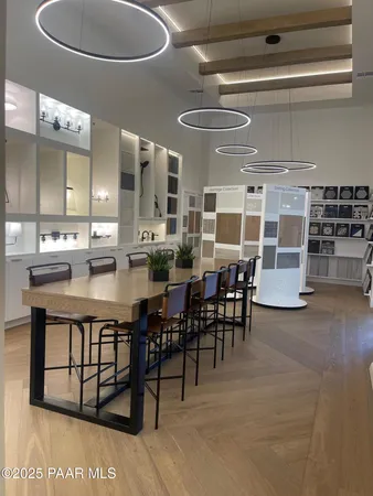 a large kitchen with a table and chairs