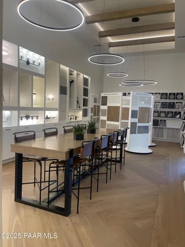 a large kitchen with a table and chairs