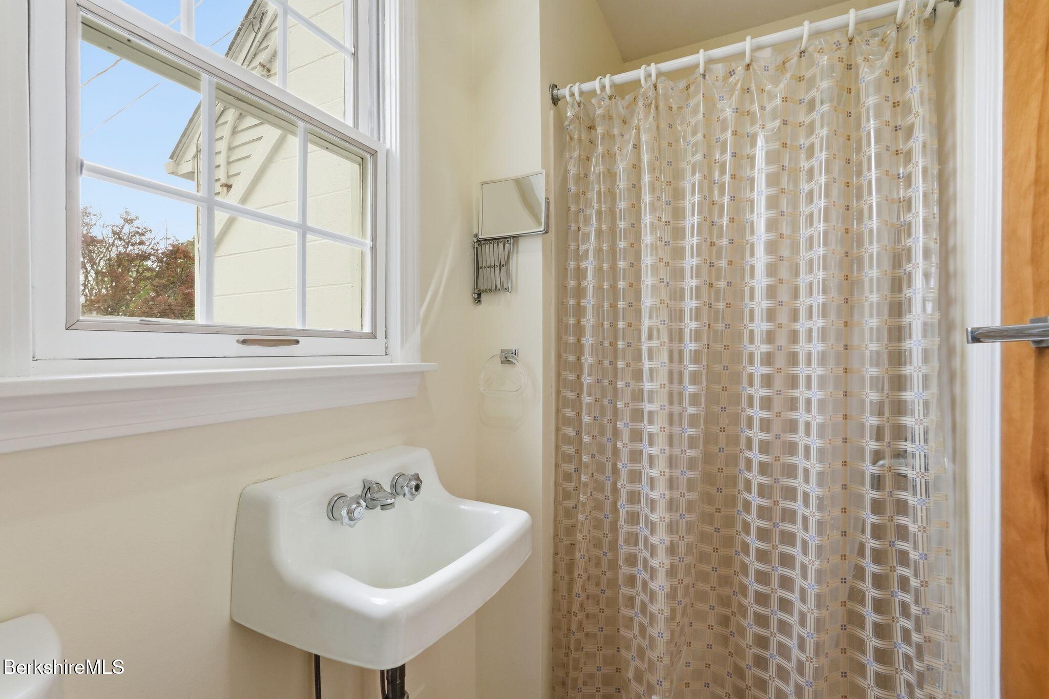 98 N Road Monroe, MA 01247 - Photo 21 of 32 a bathroom with a sink and a window
