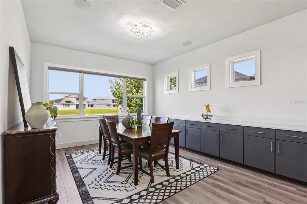 8743 Sanders Tree Loop Wesley Chapel, FL 33545 - Photo 12 of 41 a dining room with furniture and window