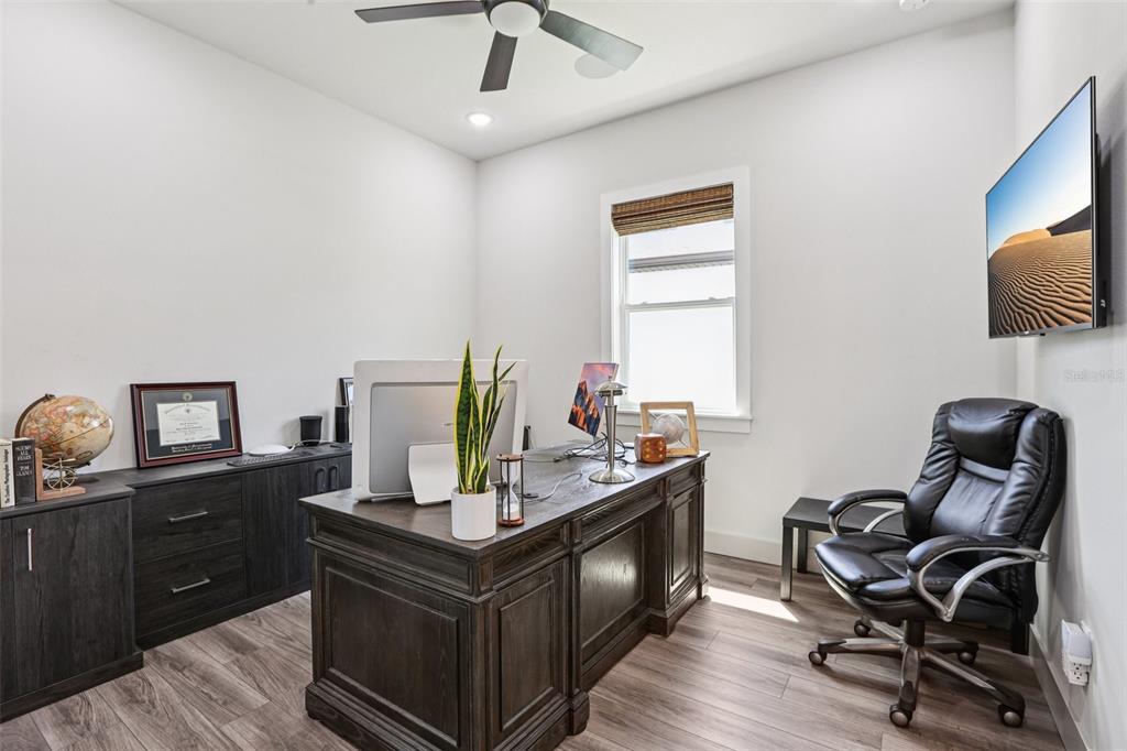 8743 Sanders Tree Loop Wesley Chapel, FL 33545 - Photo 19 of 41 a view of a workspace with furniture