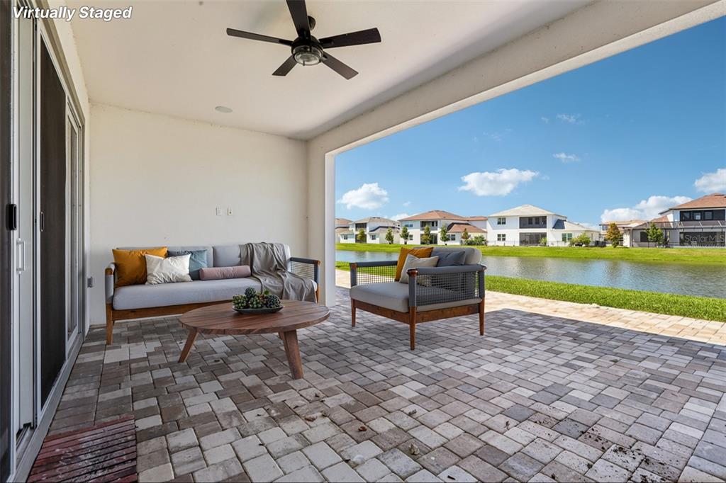 8743 Sanders Tree Loop Wesley Chapel, FL 33545 - Photo 25 of 41 a building outdoor space with patio furniture and outdoor view