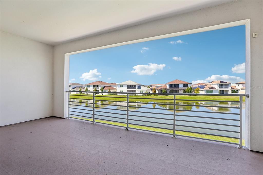 8743 Sanders Tree Loop Wesley Chapel, FL 33545 - Photo 26 of 41 a view of an empty room with a floor to ceiling window