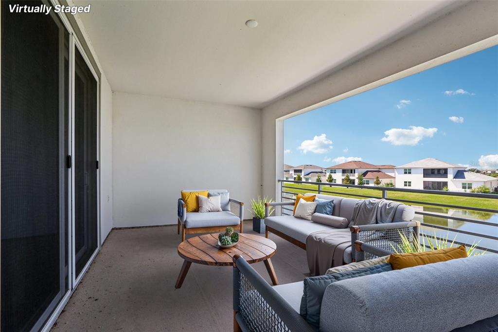 8743 Sanders Tree Loop Wesley Chapel, FL 33545 - Photo 27 of 41 a outdoor living room with furniture and a large window