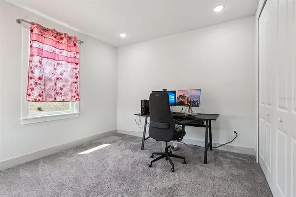 a workspace with furniture and a window