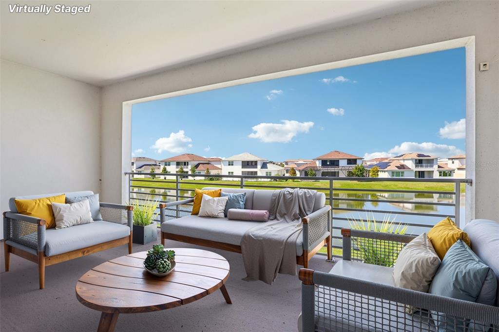 8743 Sanders Tree Loop Wesley Chapel, FL 33545 - Photo 33 of 41 a living room with furniture and a floor to ceiling window