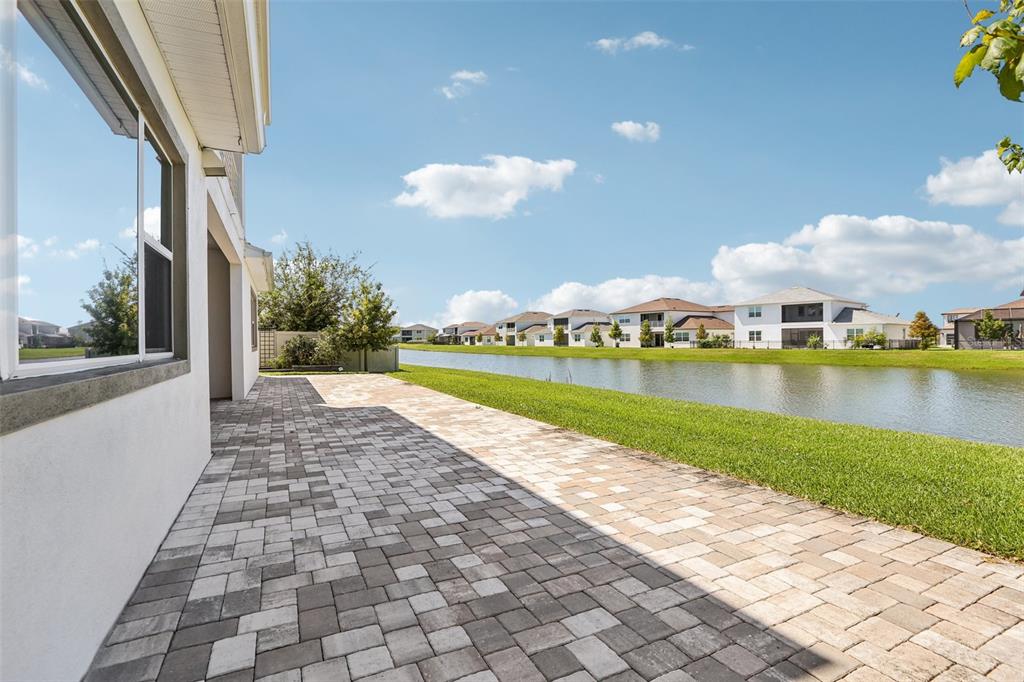 8743 Sanders Tree Loop Wesley Chapel, FL 33545 - Photo 36 of 41 a view of a lake with a city view