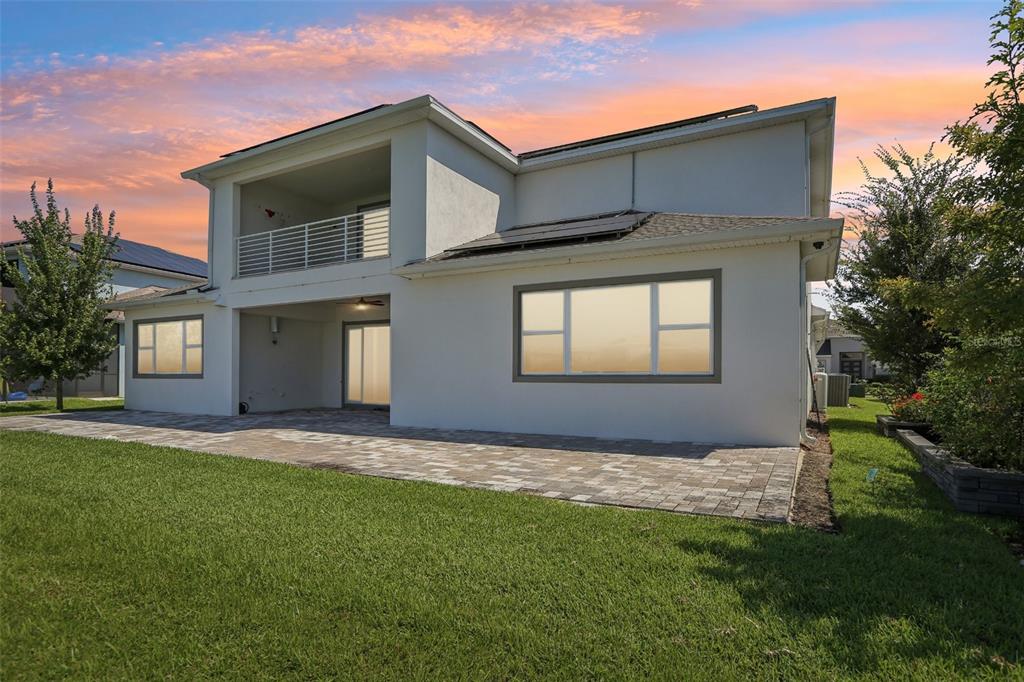 8743 Sanders Tree Loop Wesley Chapel, FL 33545 - Photo 37 of 41 a front view of a house with a yard