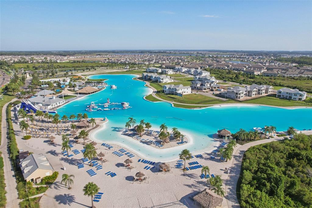 8743 Sanders Tree Loop Wesley Chapel, FL 33545 - Photo 40 of 41 an aerial view of a ocean with residential house swimming pool and ocean view