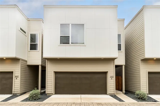 a front view of a house with yard