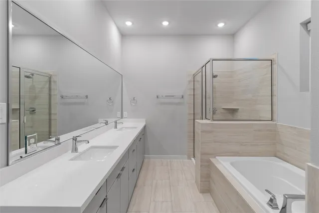 a bathroom with a bathtub and a sink