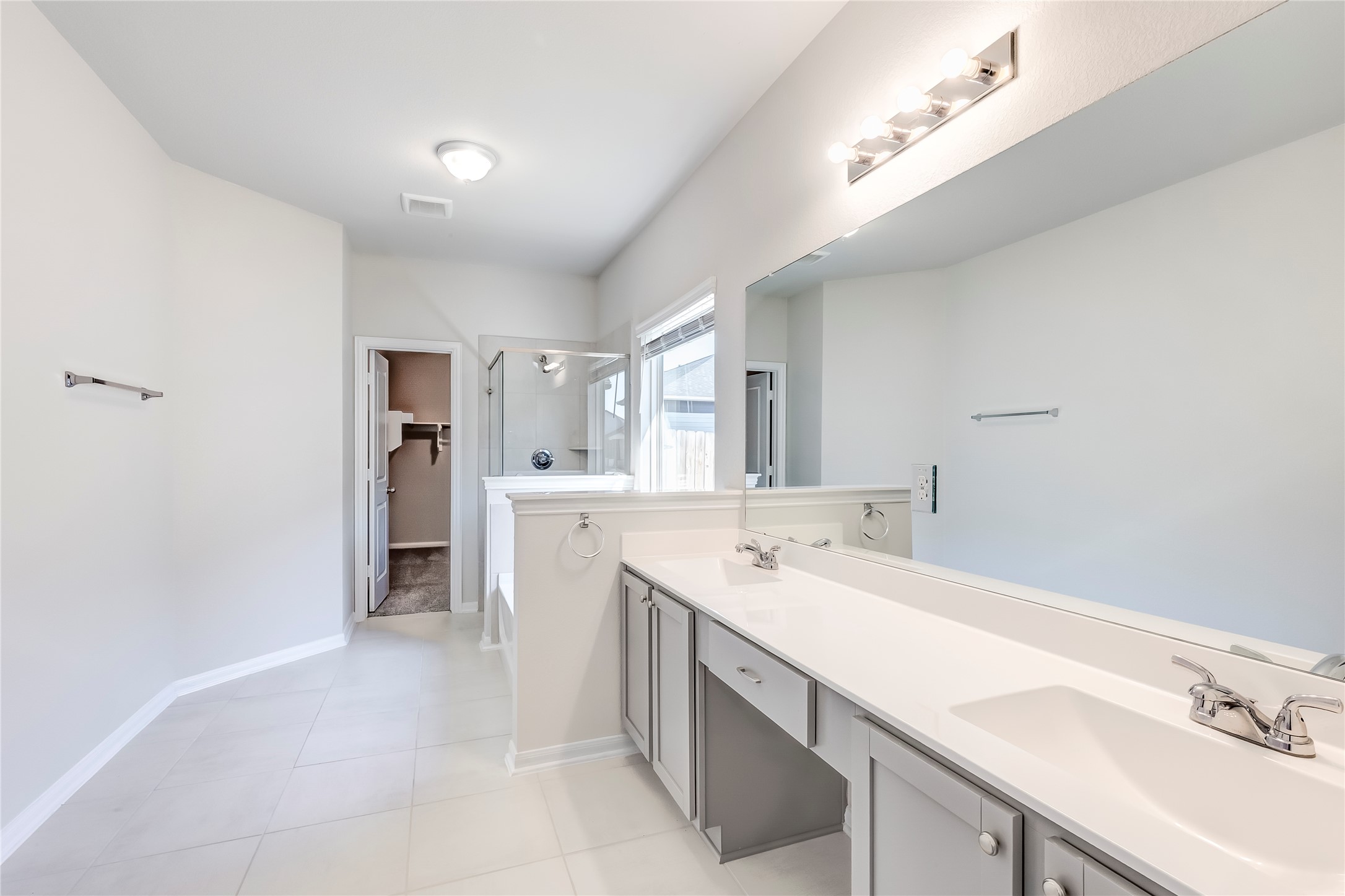 141 Yellowstone Drive Kyle, TX 78640 - Photo 19 of 33 a view of a kitchen with a sink and refrigerator