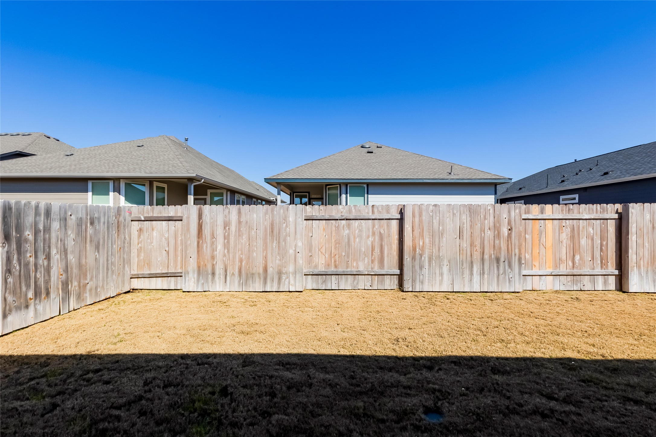 141 Yellowstone Drive Kyle, TX 78640 - Photo 26 of 33 a front view of a house with a yard