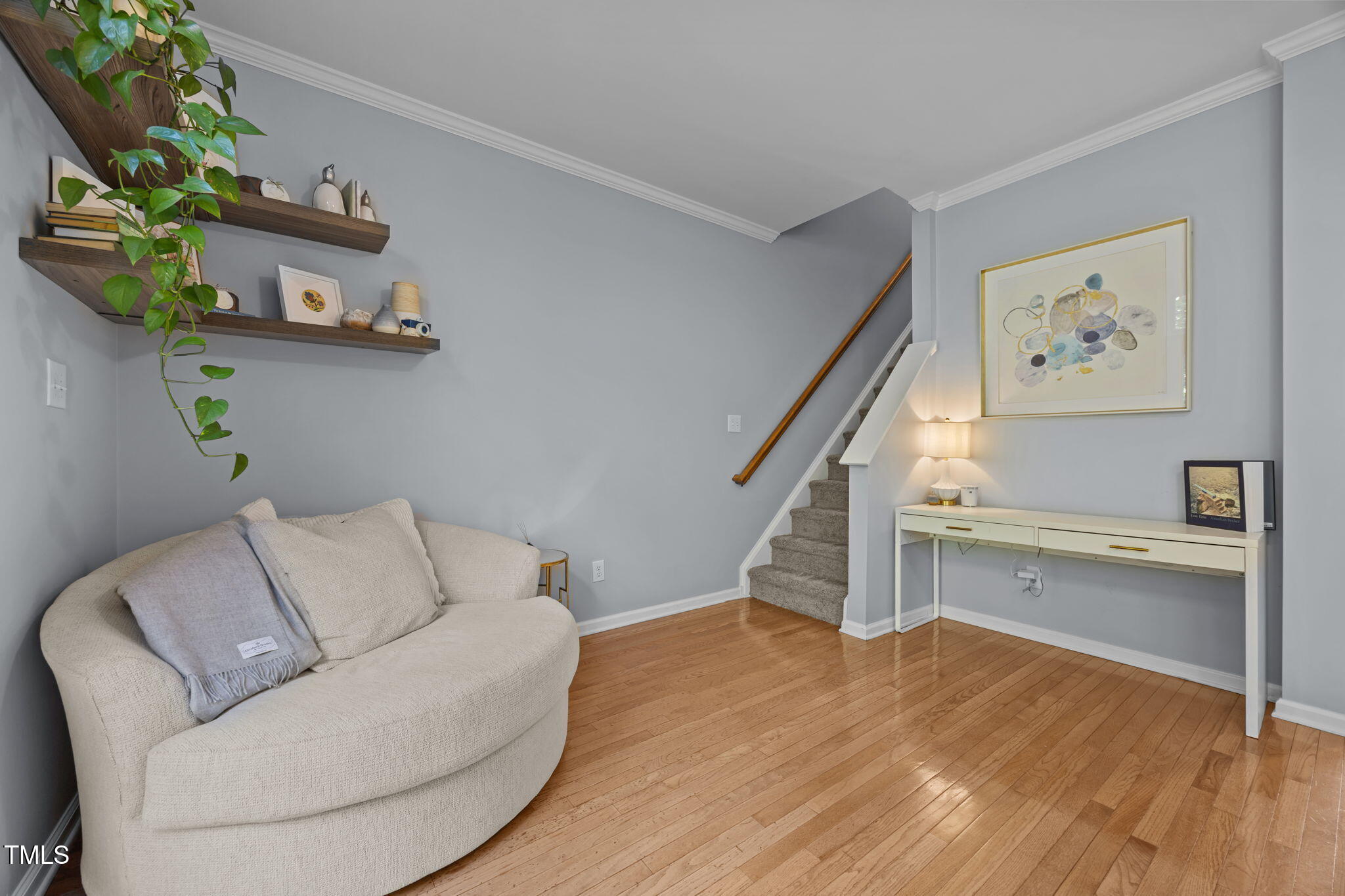 6825 Middleboro Drive Raleigh, NC 27612 - Photo 19 of 38 a living room with furniture and a wooden floor