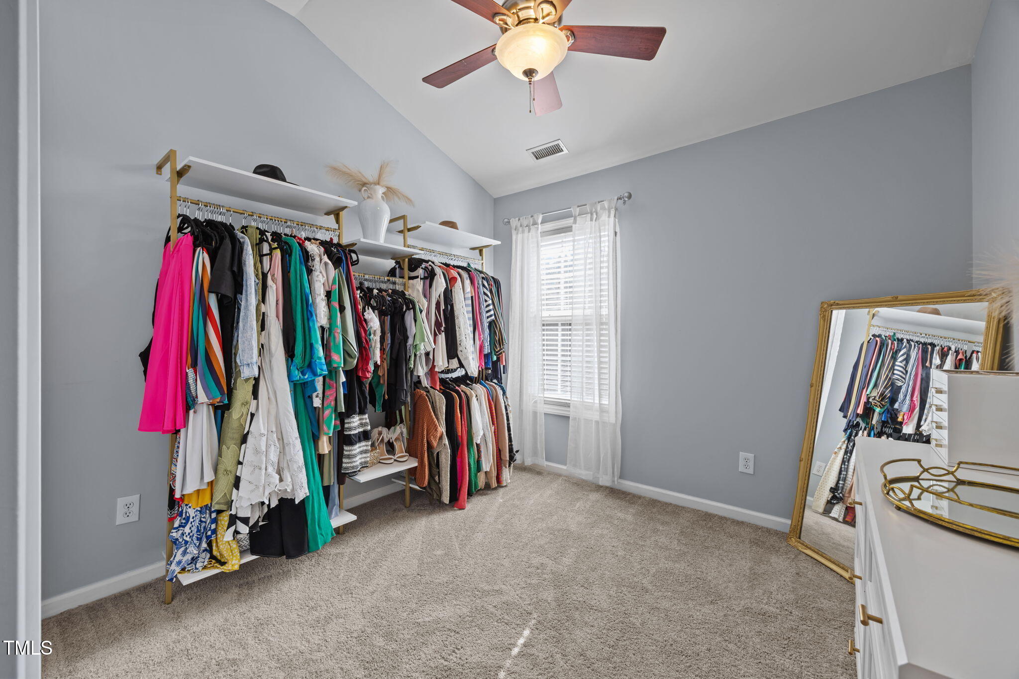 6825 Middleboro Drive Raleigh, NC 27612 - Photo 21 of 38 a view of walk in closet with clothes