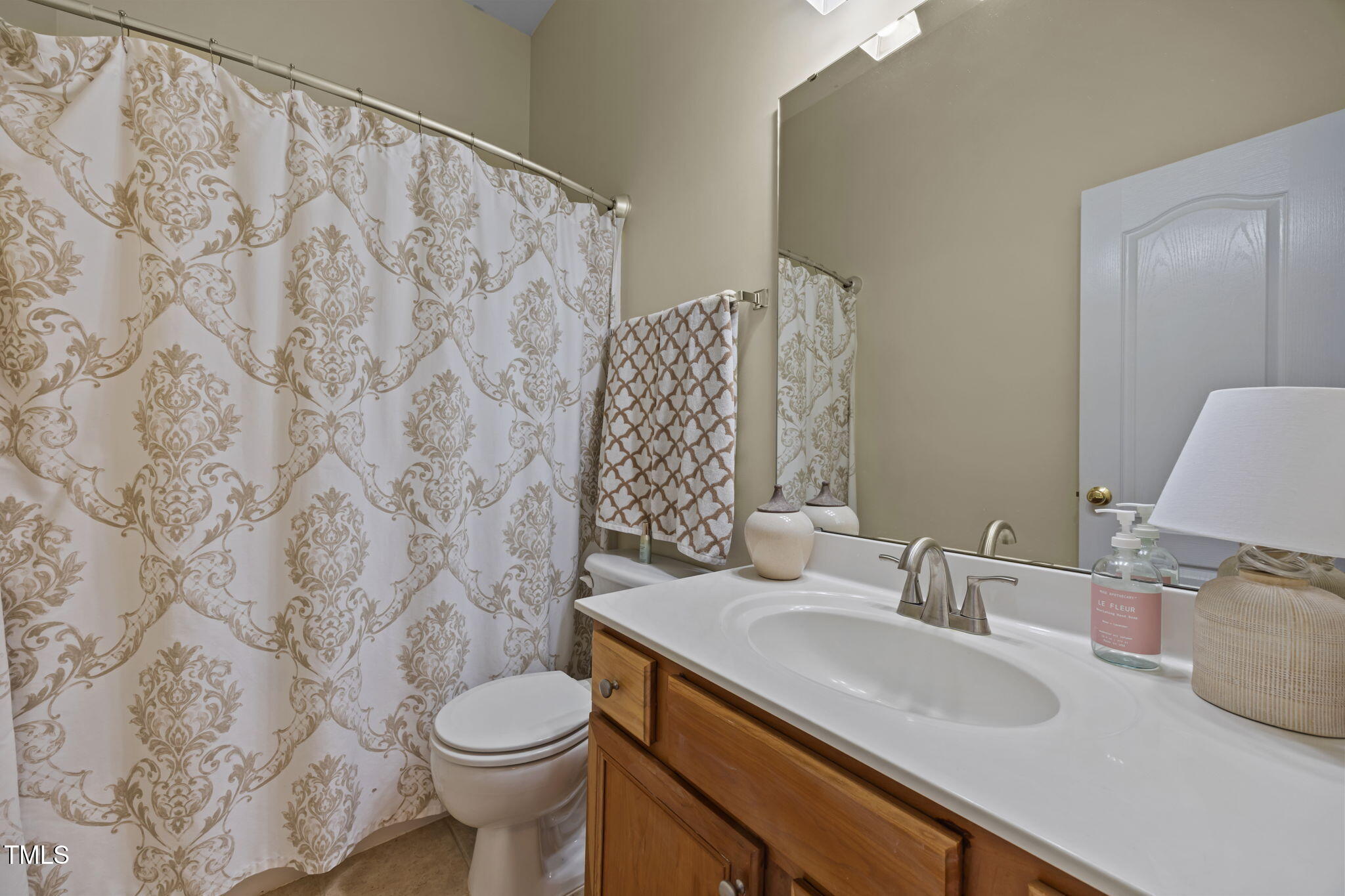 6825 Middleboro Drive Raleigh, NC 27612 - Photo 23 of 38 a bathroom with a sink and a toilet