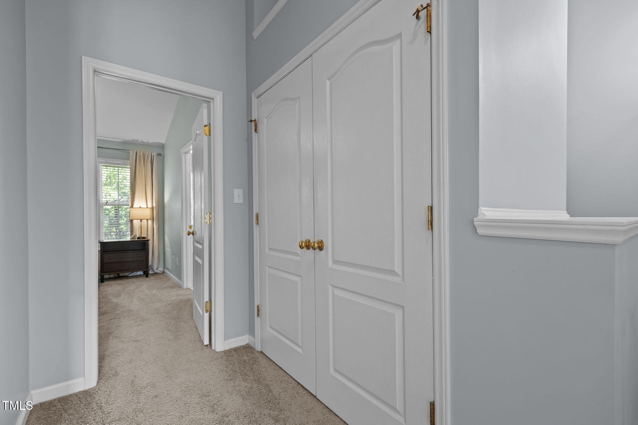 6825 Middleboro Drive Raleigh, NC 27612 - Photo 28 of 38 a view of a livingroom from a hallway