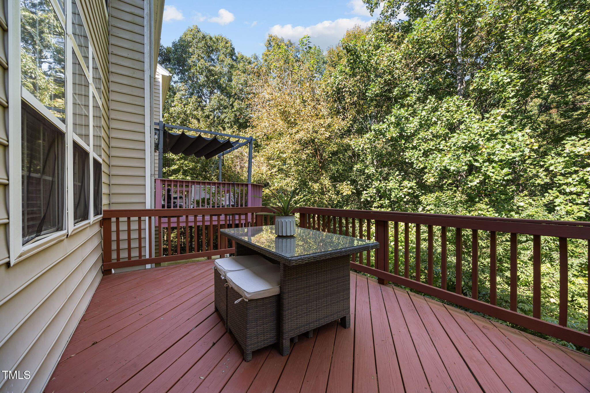 6825 Middleboro Drive Raleigh, NC 27612 - Photo 29 of 38 a balcony with wooden floor and furniture