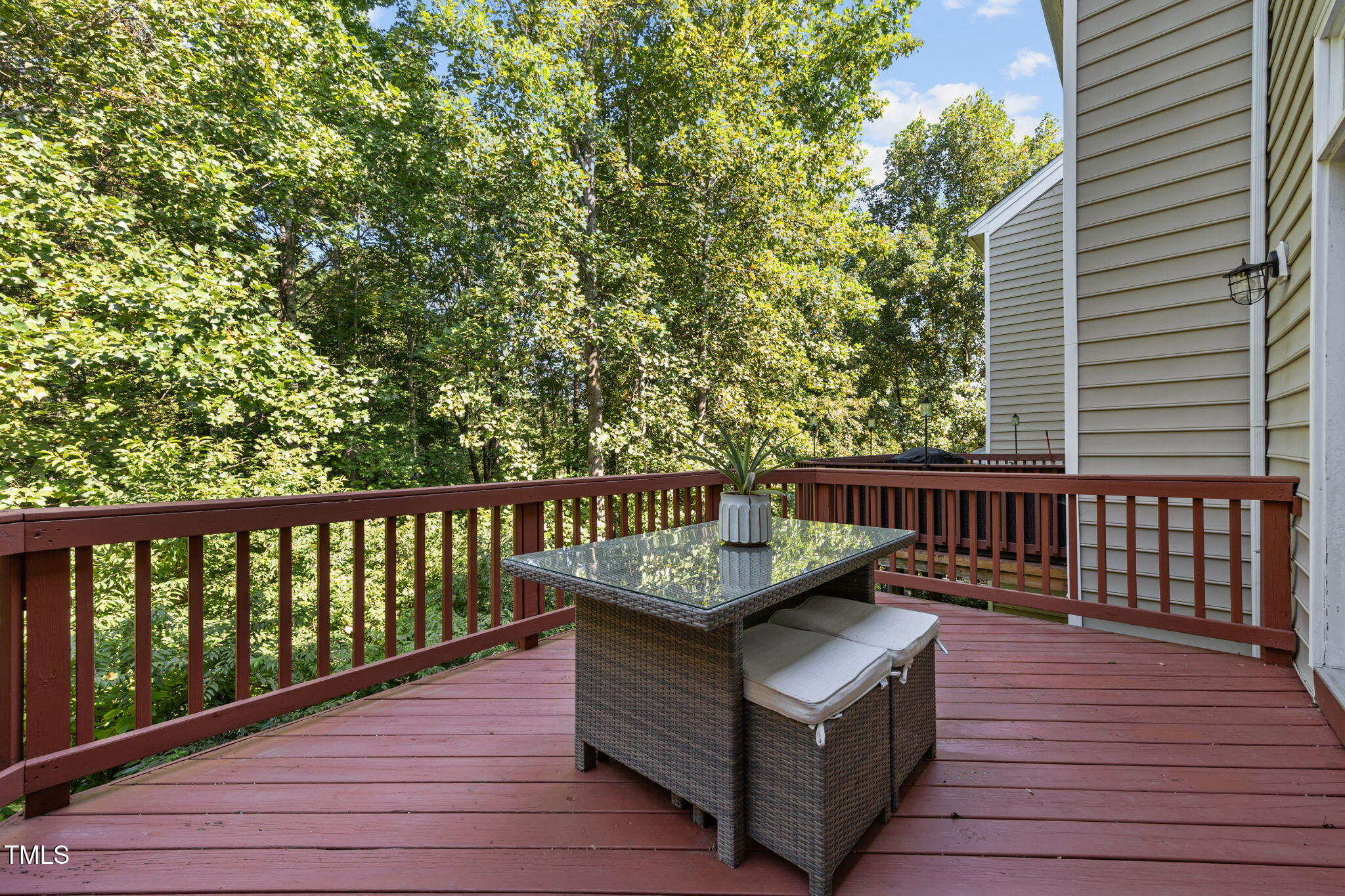 6825 Middleboro Drive Raleigh, NC 27612 - Photo 30 of 38 a view of a balcony with wooden floor and fence