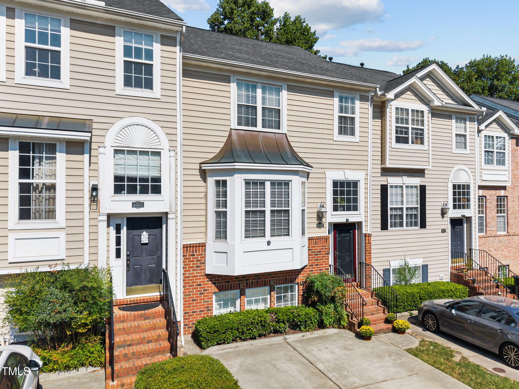 6825 Middleboro Drive Raleigh, NC 27612 - Photo 3 of 38 a front view of a house with a yard