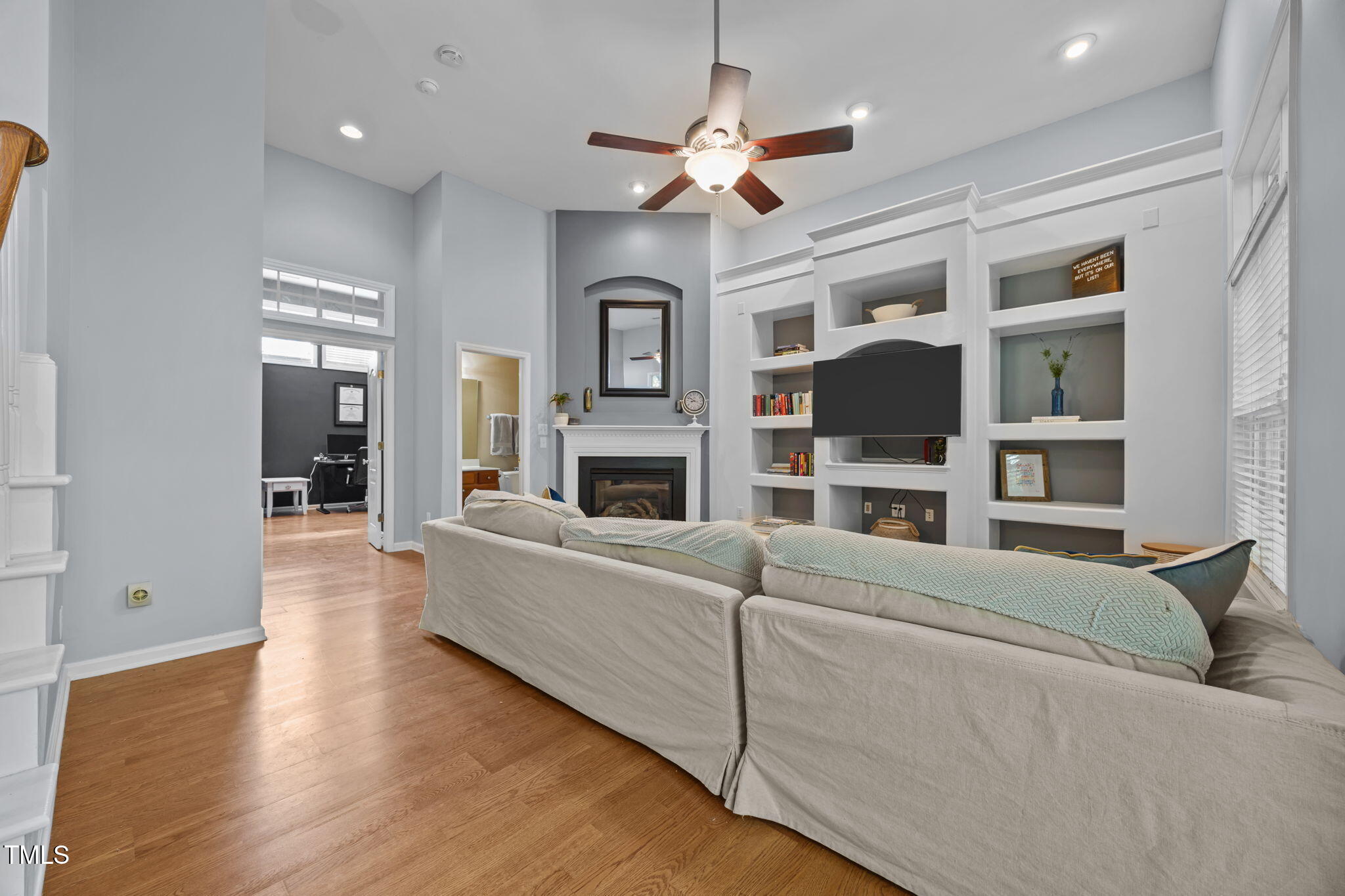 6825 Middleboro Drive Raleigh, NC 27612 - Photo 31 of 38 a living room with furniture and a fireplace